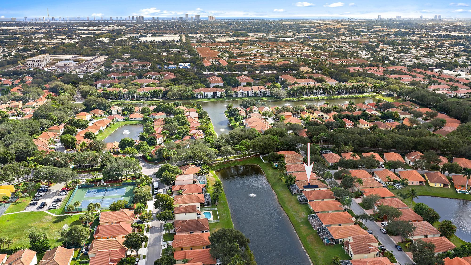 5010 Elpine Way Riviera Beach, FL 33418 - Photo 24 of 27 an aerial view of residential houses with outdoor space