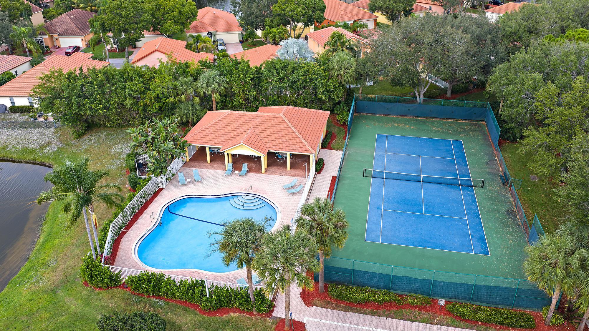 5010 Elpine Way Riviera Beach, FL 33418 - Photo 26 of 27 an aerial view of house with yard swimming pool and outdoor seating