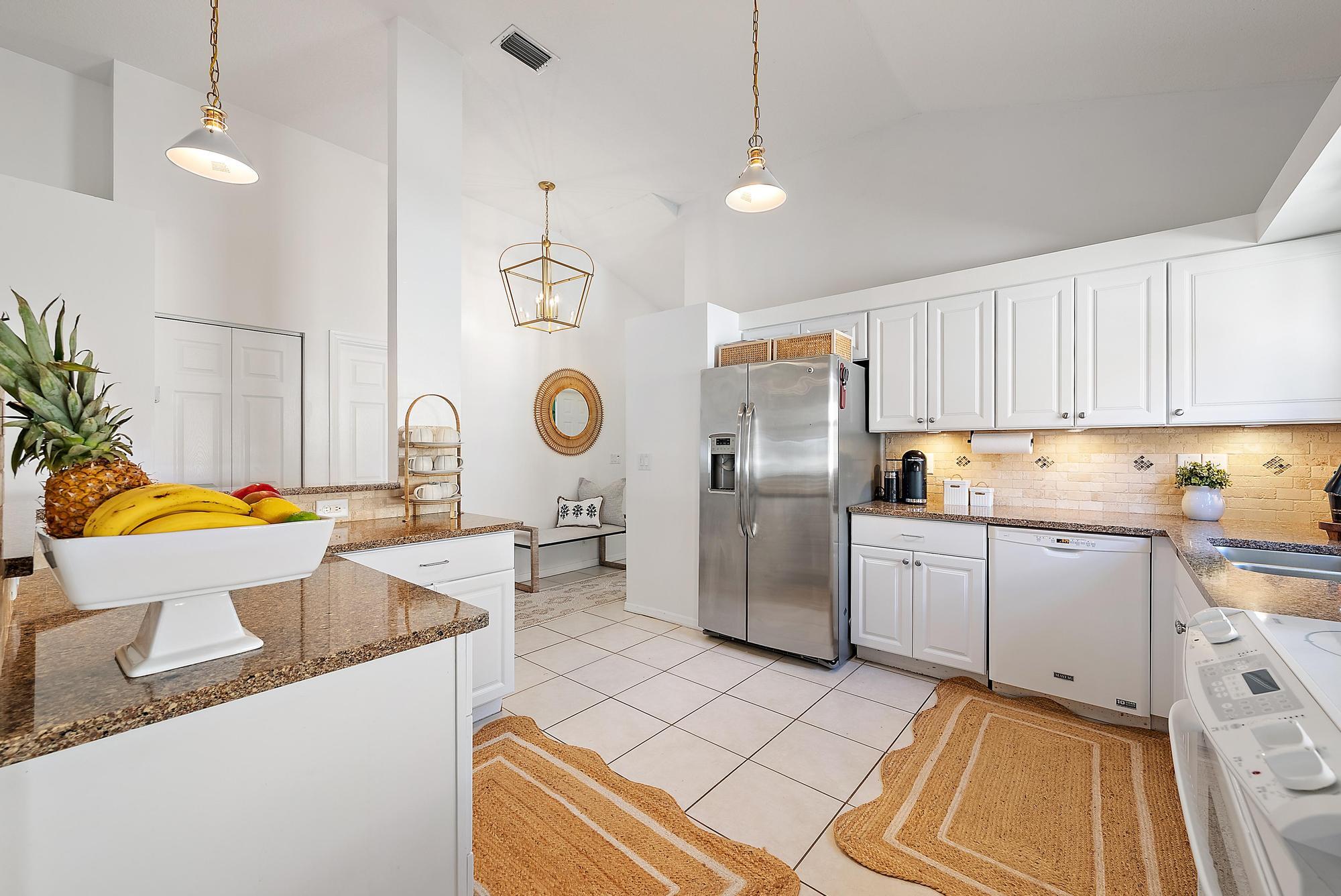 5010 Elpine Way Riviera Beach, FL 33418 - Photo 6 of 27 a kitchen with a sink and a stove top oven
