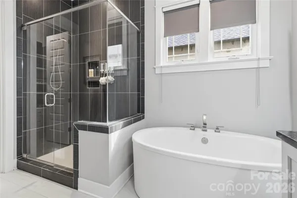 a white bath tub sitting next to a white sink