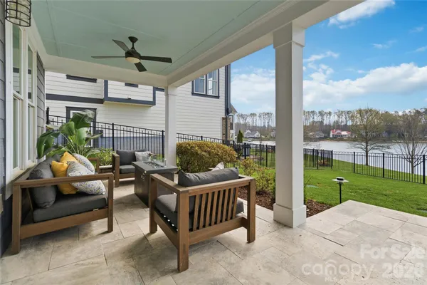 a balcony with furniture and a garden