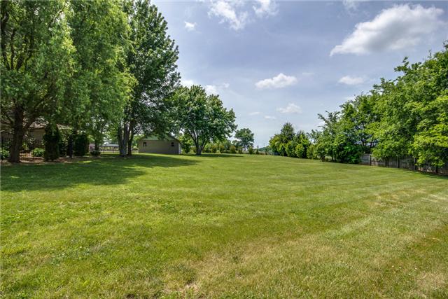 220 Bethlehem Road Lebanon, TN 37087 - Photo 17 of 20 a backyard of a house with lots of green space and garden