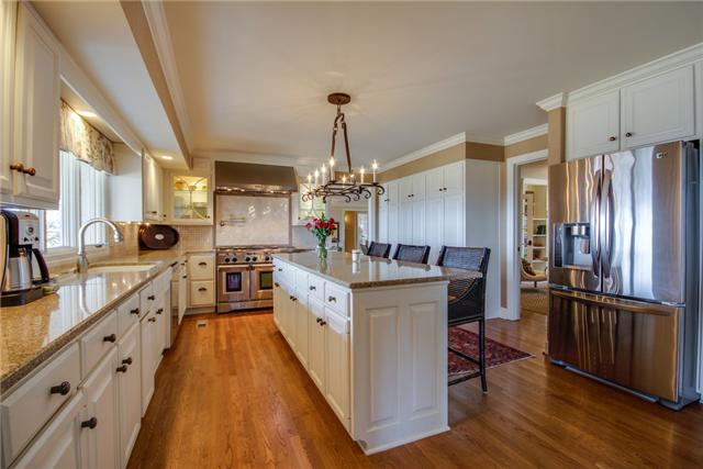 220 Bethlehem Road Lebanon, TN 37087 - Photo 7 of 20 a large kitchen with stainless steel appliances granite countertop a stove refrigerator and a view of living room