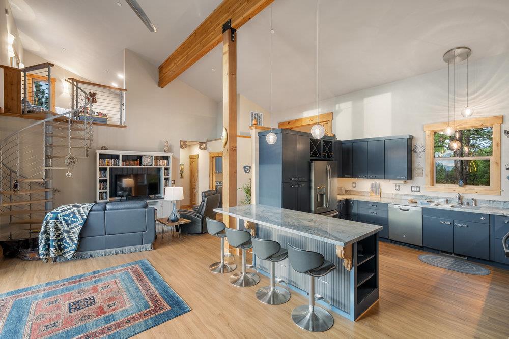 522 Night Hawk Portola, CA 96122 - Photo 16 of 54 a living room with fireplace furniture and a flat screen tv