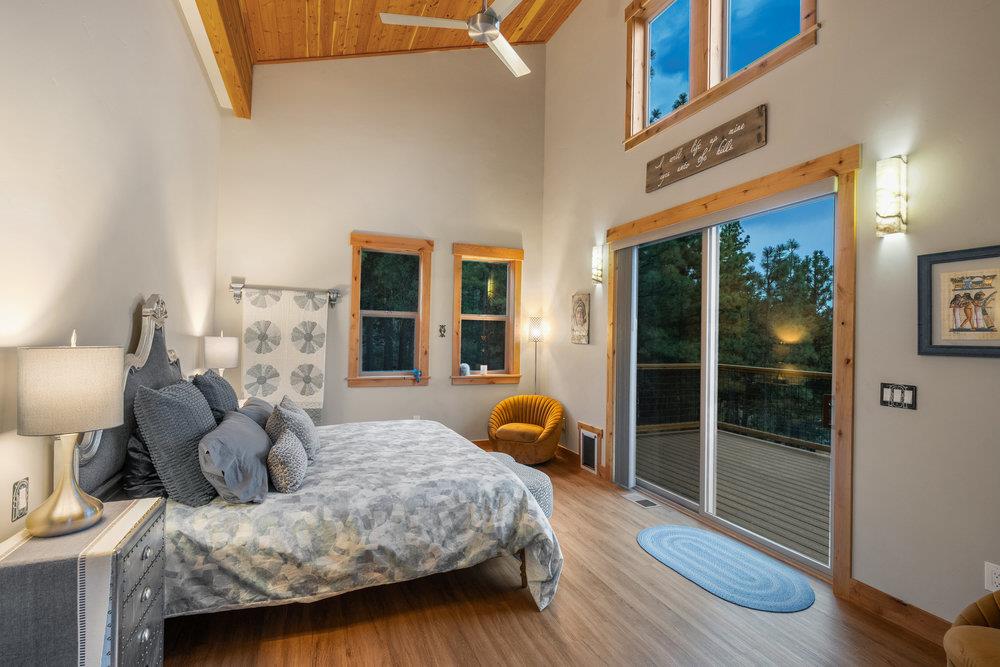 522 Night Hawk Portola, CA 96122 - Photo 20 of 54 a bedroom with a bed and wooden floor