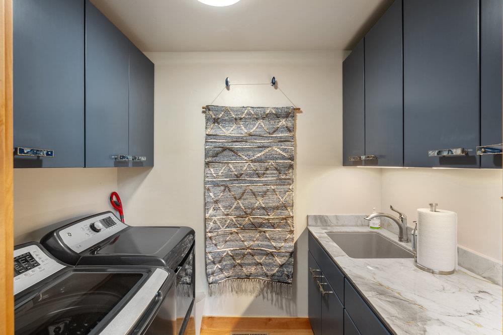 522 Night Hawk Portola, CA 96122 - Photo 30 of 54 a kitchen with granite countertop a sink stove and cabinets