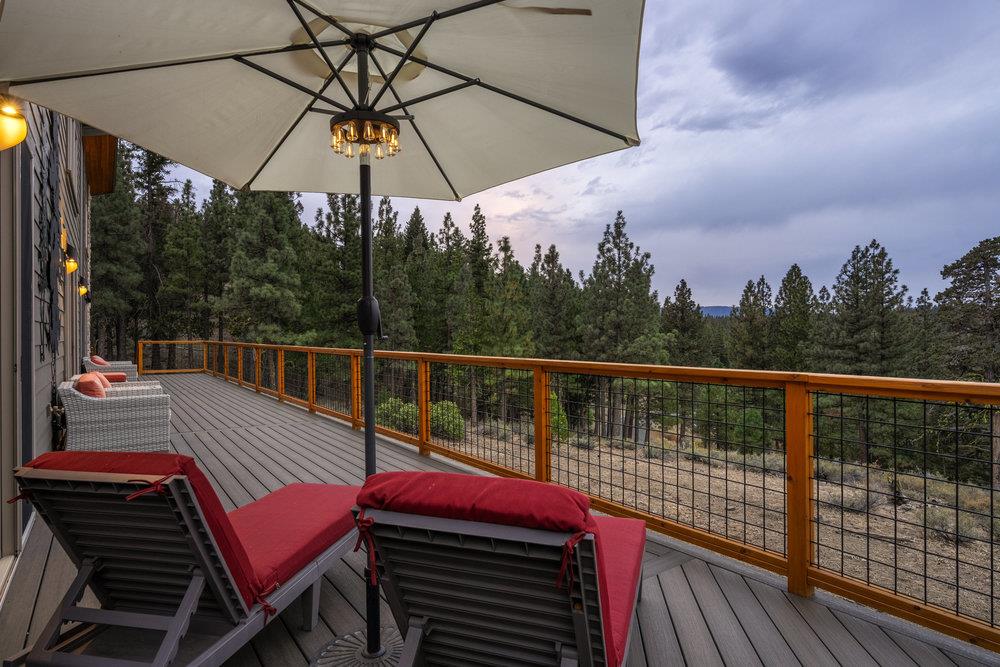522 Night Hawk Portola, CA 96122 - Photo 35 of 54 a view of a balcony with wooden floor and outdoor seating