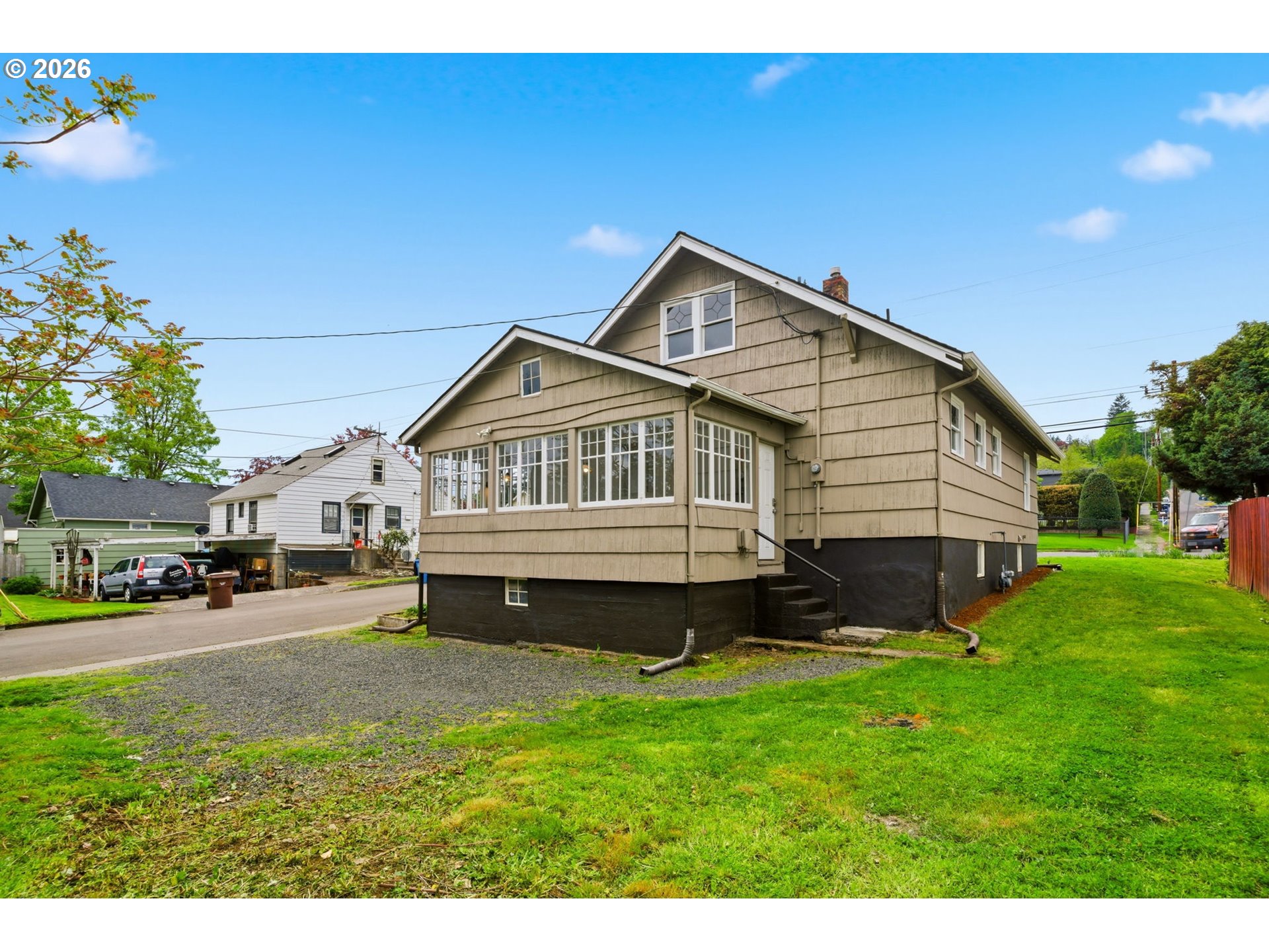 1804 Division Street Camas, WA 98607 - Photo 39 of 43 a front view of a house with a garden and yard