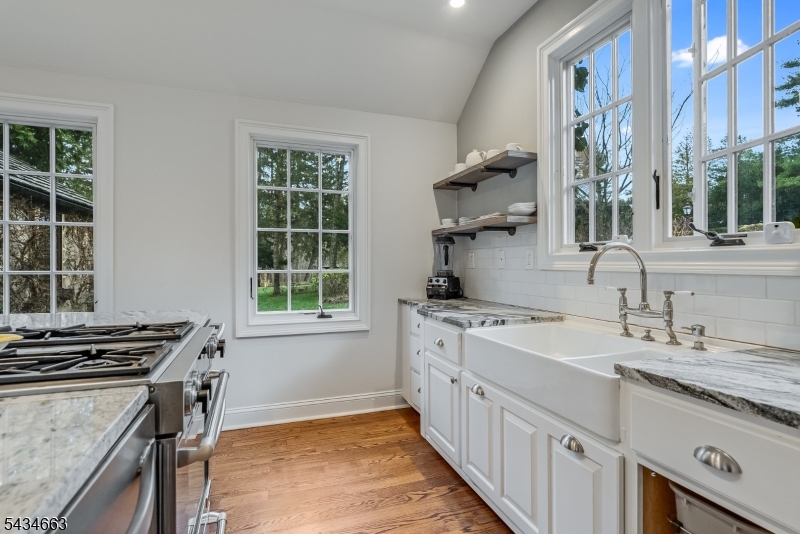 55 State Park Road Chester, NJ 07930 - Photo 40 of 48 a kitchen that has a sink and a stove