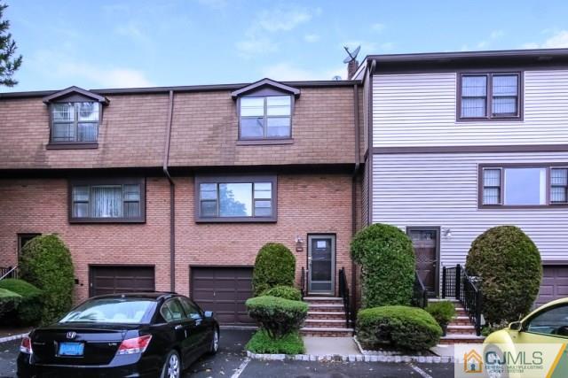7202 Hana Road Edison, NJ 08817 - Photo 1 of 25 a front view of a house with garden