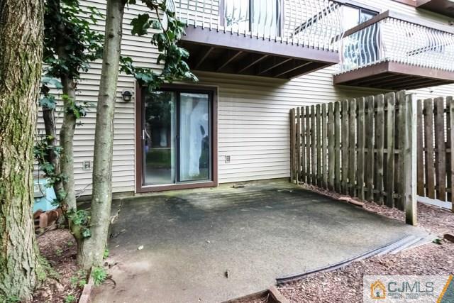 7202 Hana Road Edison, NJ 08817 - Photo 2 of 25 a view of a backyard with a small cabin and a chair