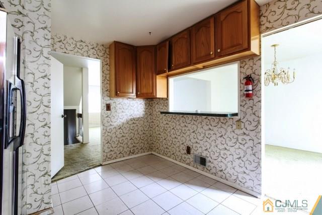 7202 Hana Road Edison, NJ 08817 - Photo 13 of 25 a bathroom with a bathtub and shower