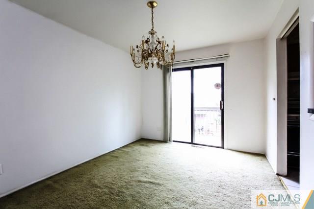 7202 Hana Road Edison, NJ 08817 - Photo 16 of 25 a view of a chandelier in big room and chandelier