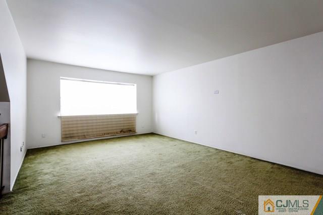 7202 Hana Road Edison, NJ 08817 - Photo 19 of 25 a view of an empty room with a window