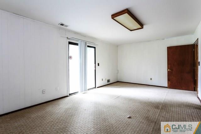 7202 Hana Road Edison, NJ 08817 - Photo 5 of 25 an empty room with windows and closet