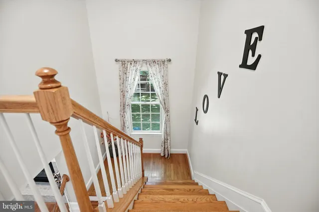 a spacious bedroom with a bed and a window