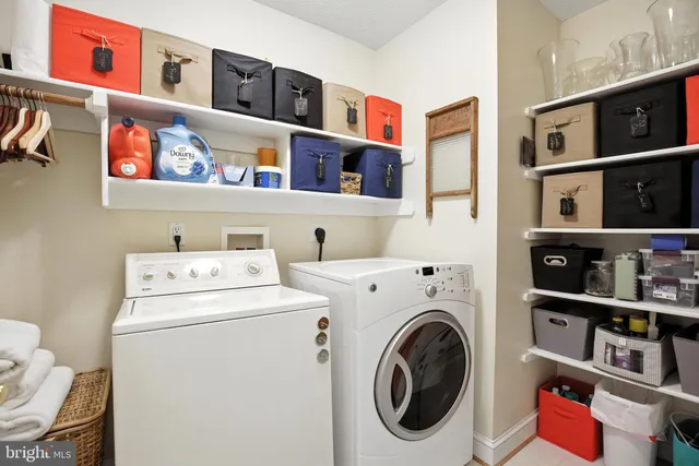 a spacious bathroom with a double vanity sink mirror and shower