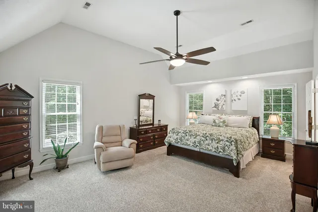 a white bath tub sitting in a bathroom next to a window
