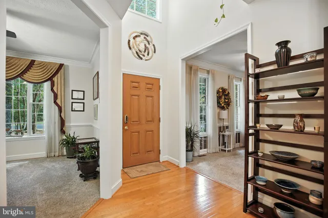 a work room with furniture and a large window