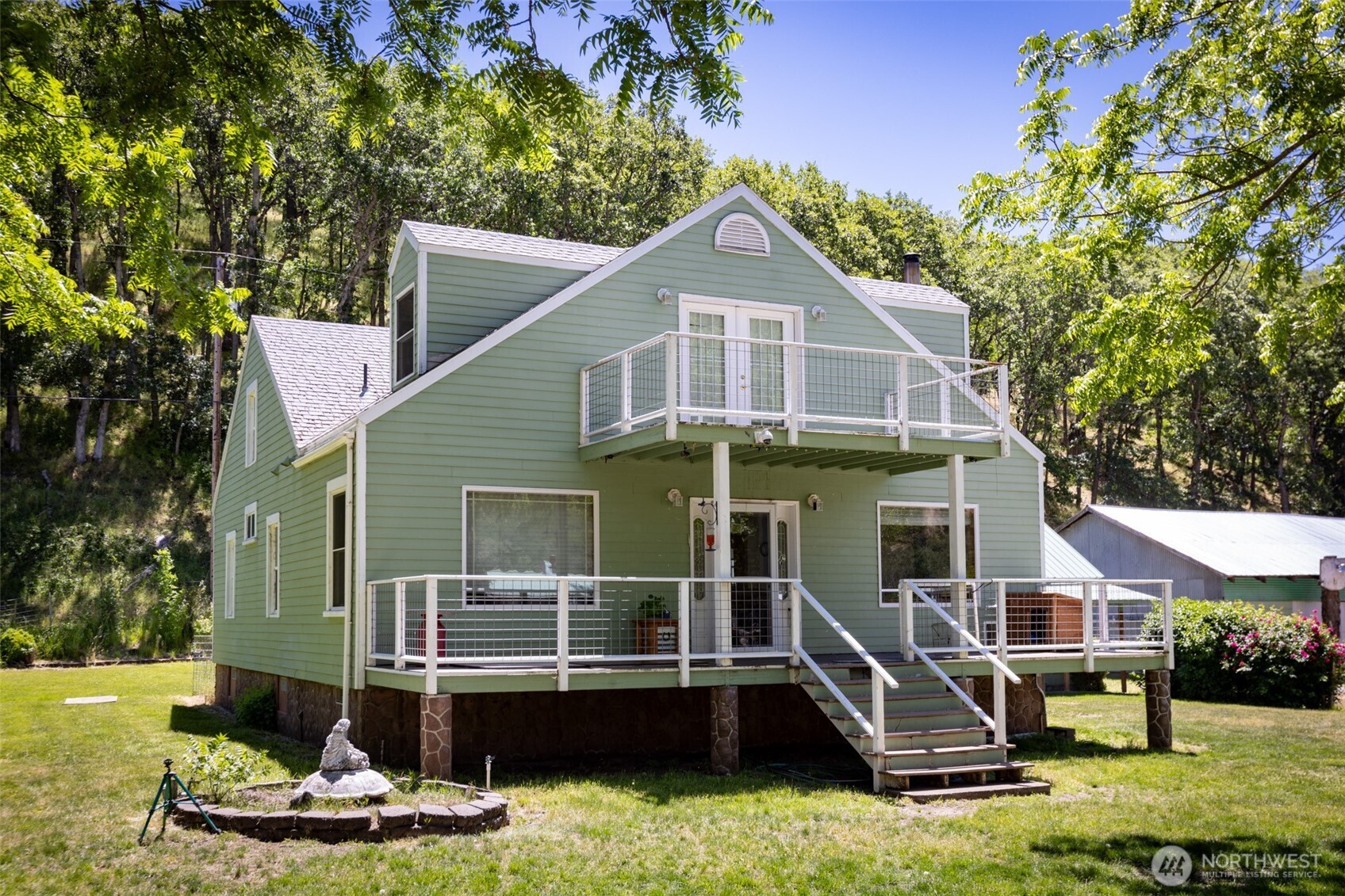 992 Highway 142 Lyle, WA 98635 - Photo 6 of 40 a view of a house with backyard