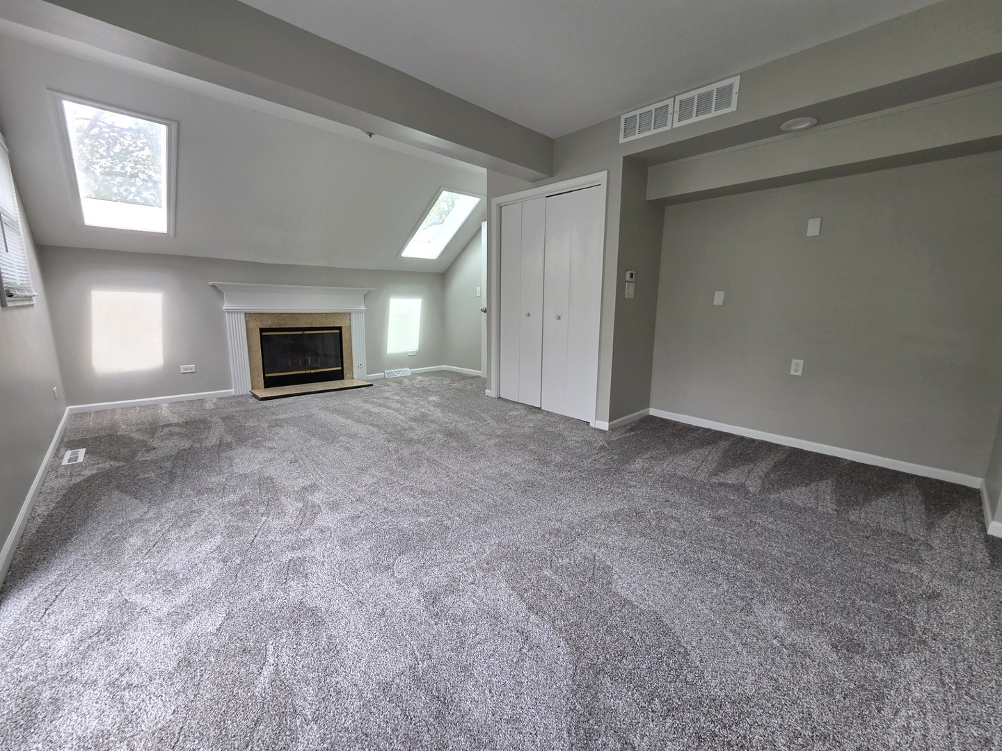 32W266 Glos Street Wayne, IL 60184 - Photo 12 of 24 a view of an empty room with a fireplace and a window