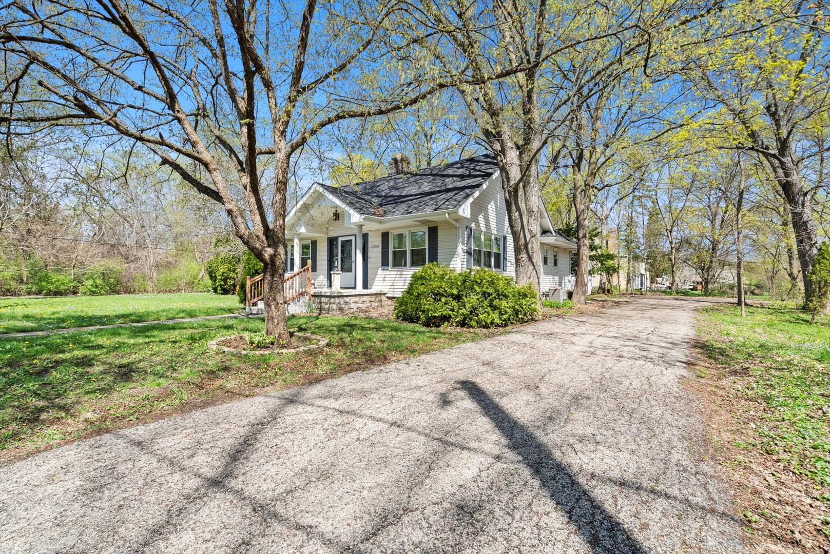32W266 Glos Street Wayne, IL 60184 - Photo 2 of 24 a front view of a house with a yard and trees