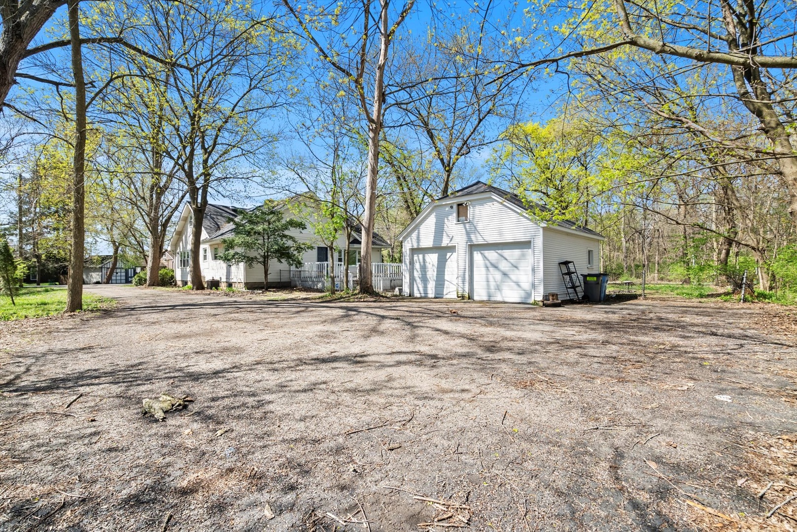 32W266 Glos Street Wayne, IL 60184 - Photo 22 of 24 a front view of a house with a yard and trees