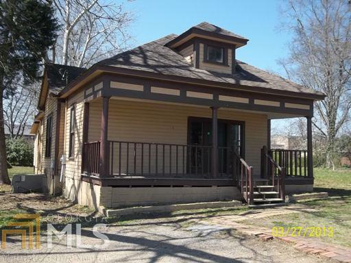10 Cherry Street Southwest Rome, GA 30165 - Photo 1 of 1 a view of a house with a small yard and wooden floor and fence