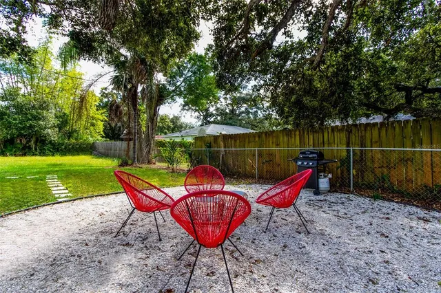 a backyard of a house with seating space