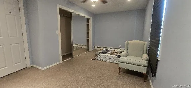 a living room with furniture and a lamp