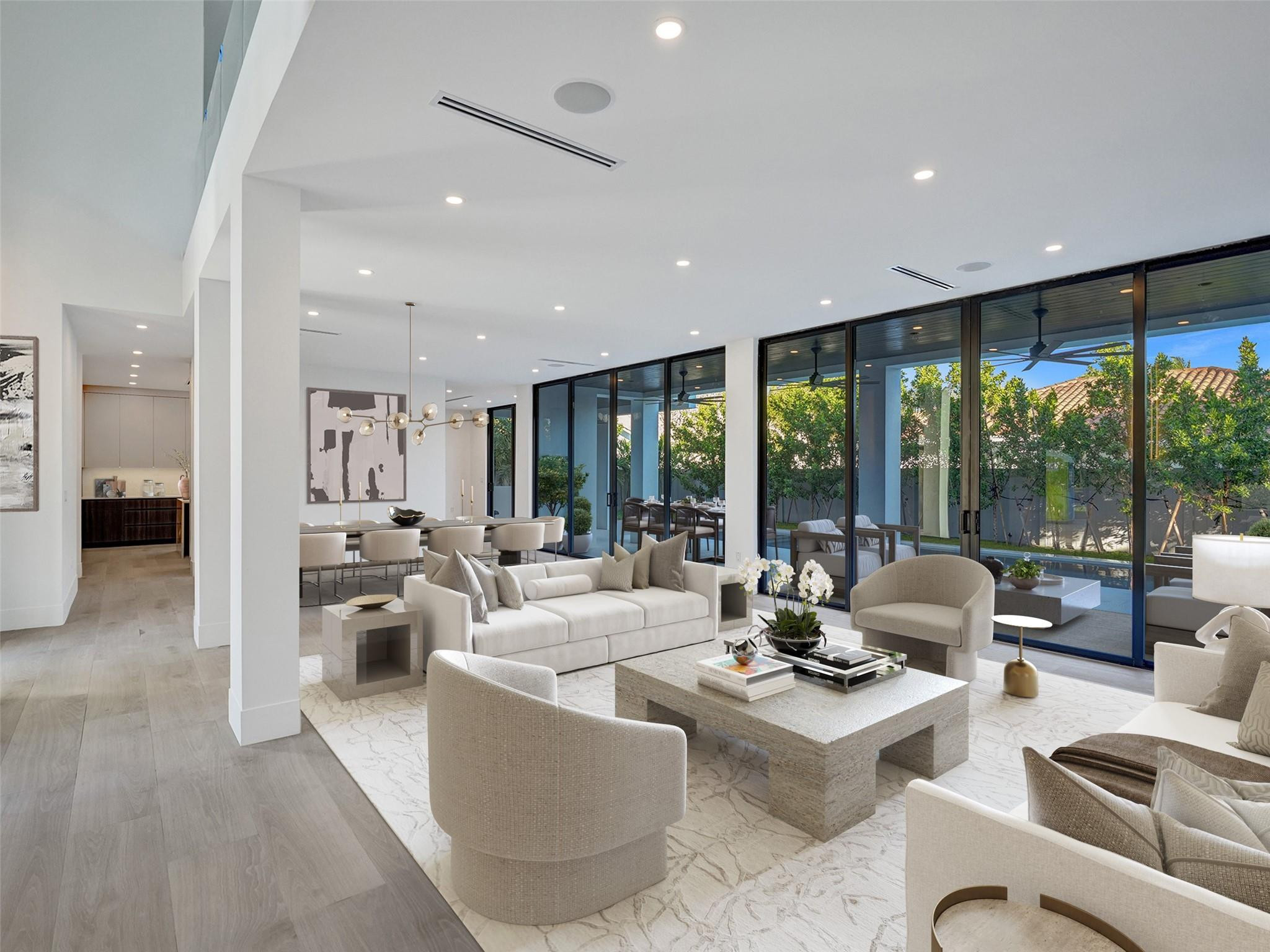 7 Gatehouse Road Fort Lauderdale, FL 33308 - Photo 6 of 51 a living room with furniture and large windows