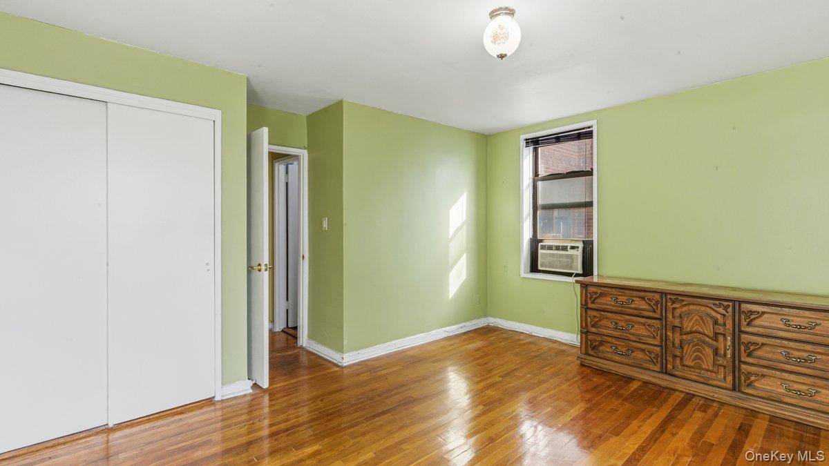 83-35 139th Street, Unit 1D Queens, NY 11435 - Photo 14 of 20 a view of a room with wooden floor