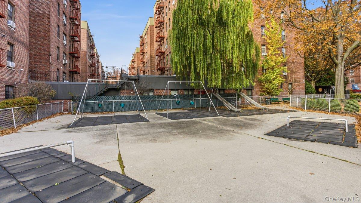 83-35 139th Street, Unit 1D Queens, NY 11435 - Photo 18 of 20 front view of a building with a garden