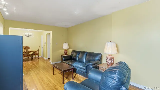 a living room with furniture and a lamp