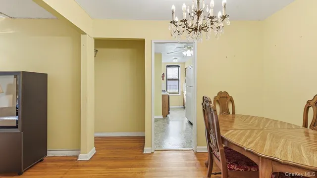 a view of a bedroom with furniture and wooden floor