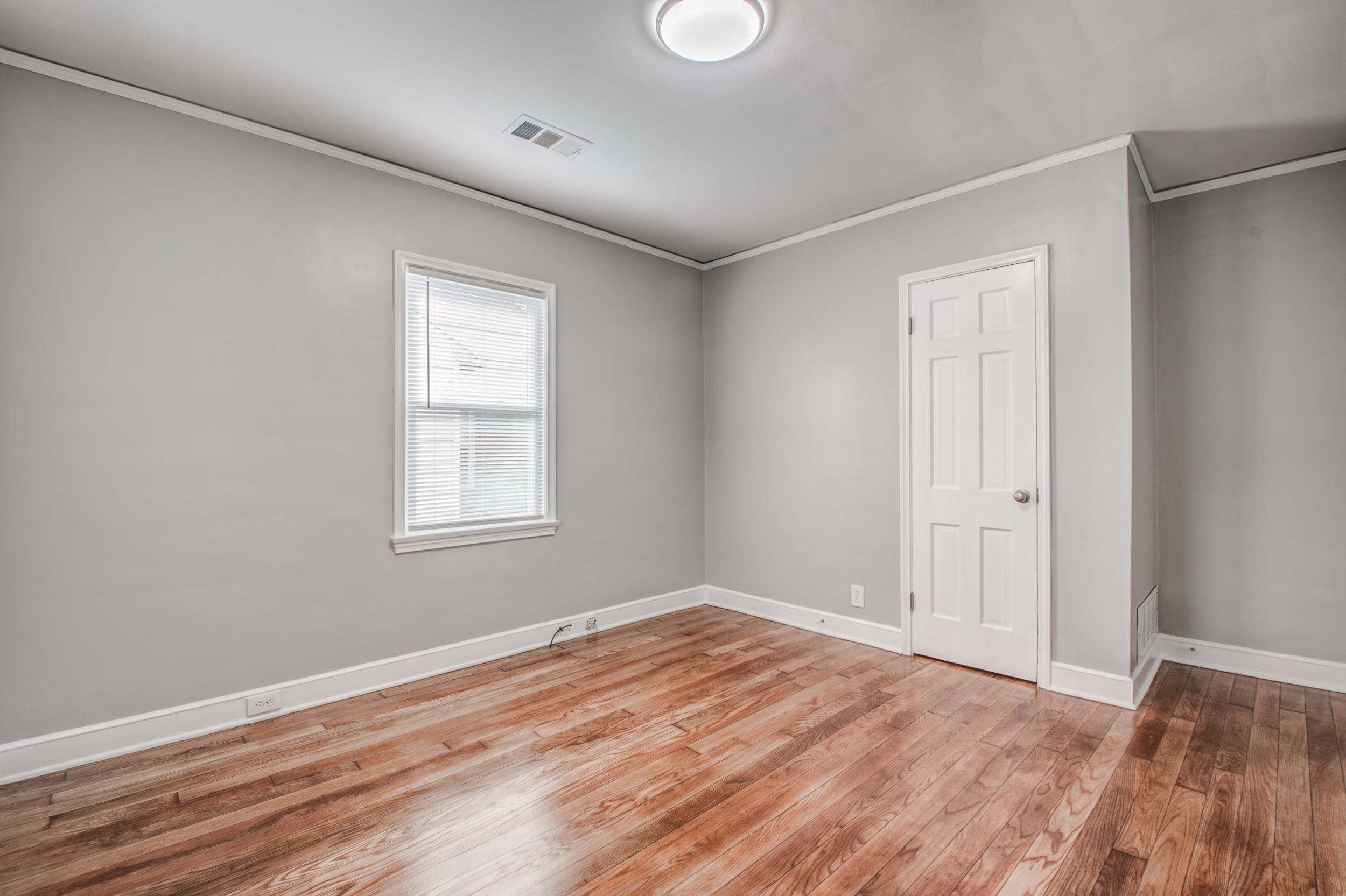 835 Watson Street Memphis, TN 38111 - Photo 13 of 24 Unfurnished bedroom with ornamental molding and light wood-style flooring