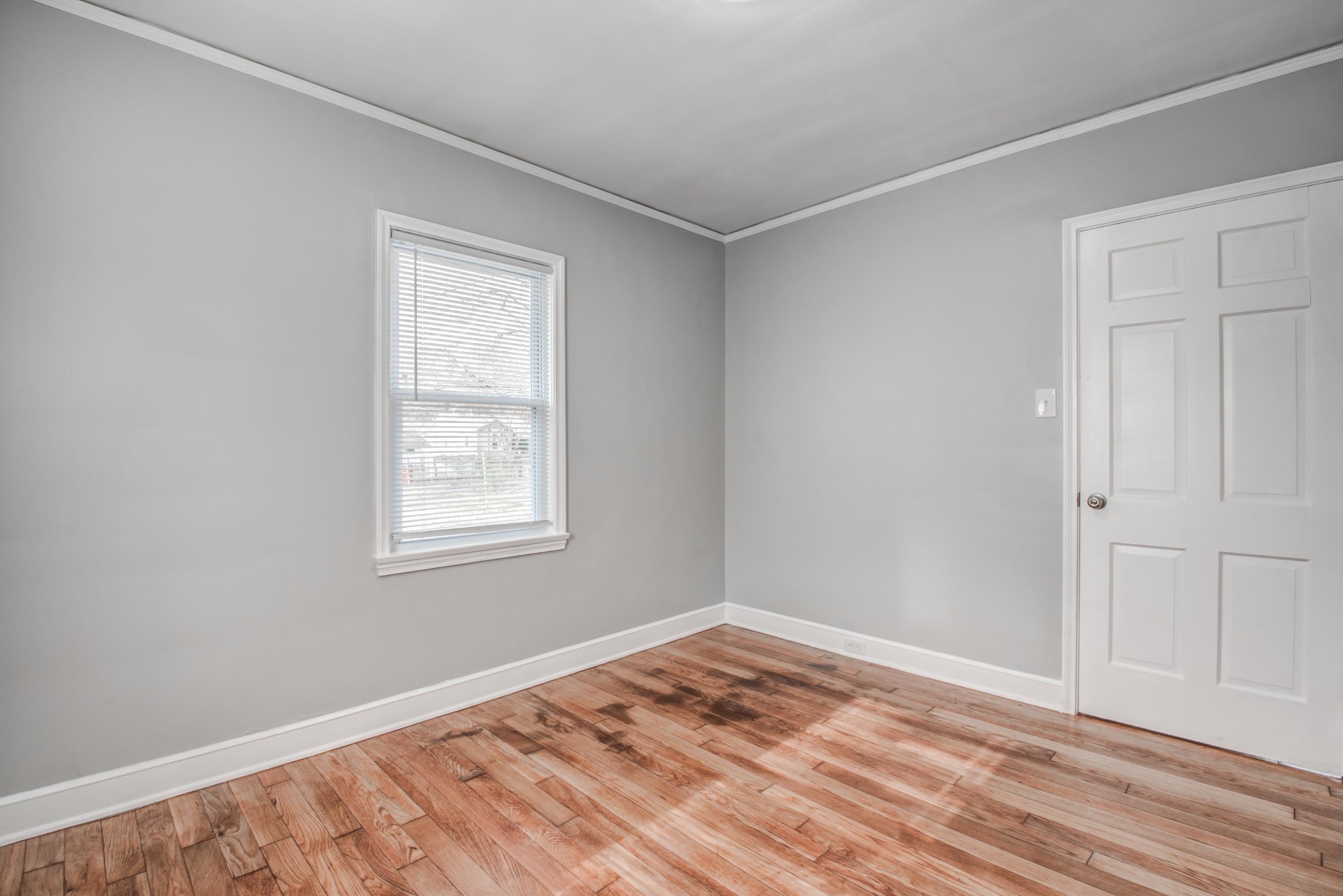 835 Watson Street Memphis, TN 38111 - Photo 18 of 24 Spare room featuring crown molding and light wood finished floors