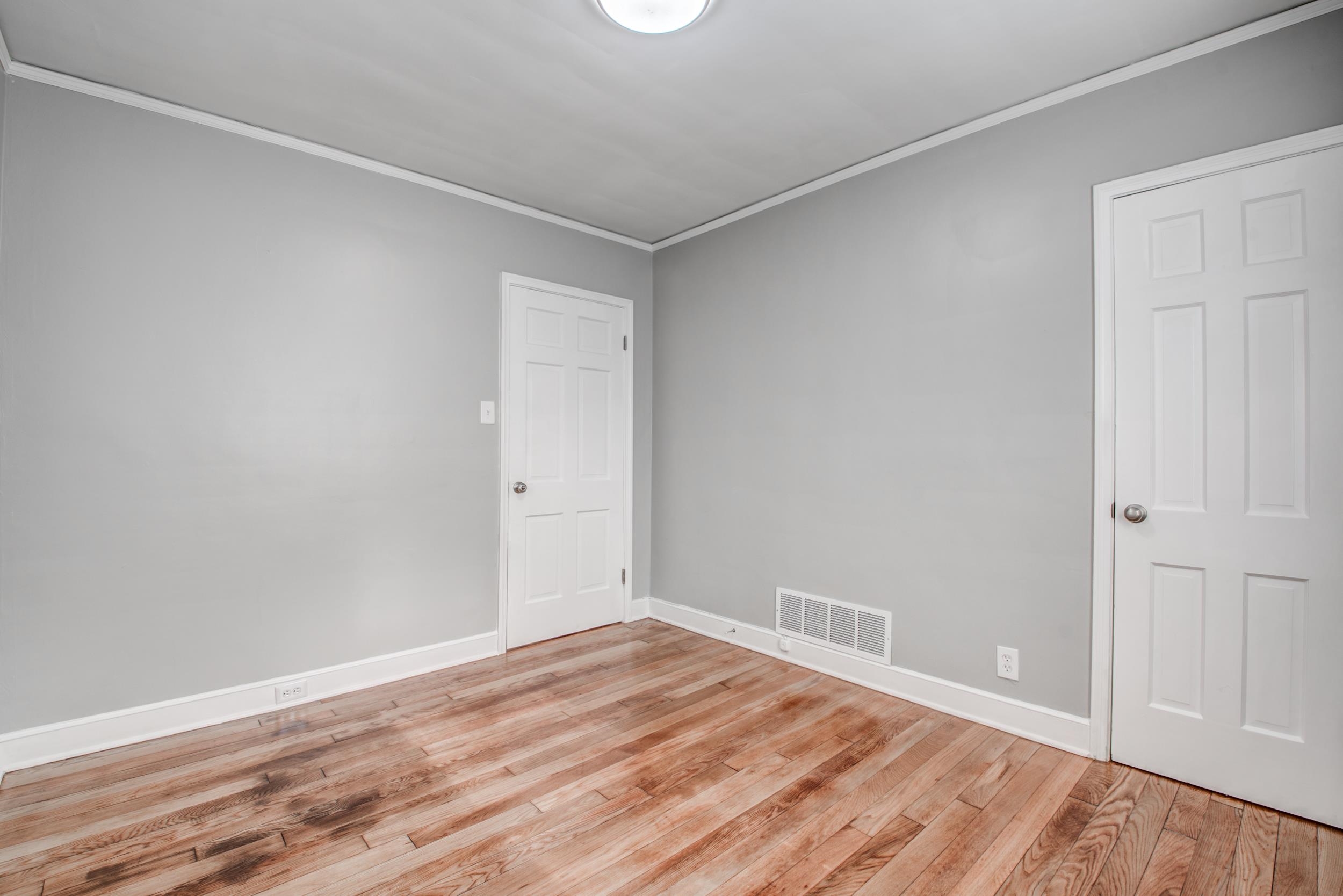 835 Watson Street Memphis, TN 38111 - Photo 19 of 24 Empty room with ornamental molding and light wood-style floors