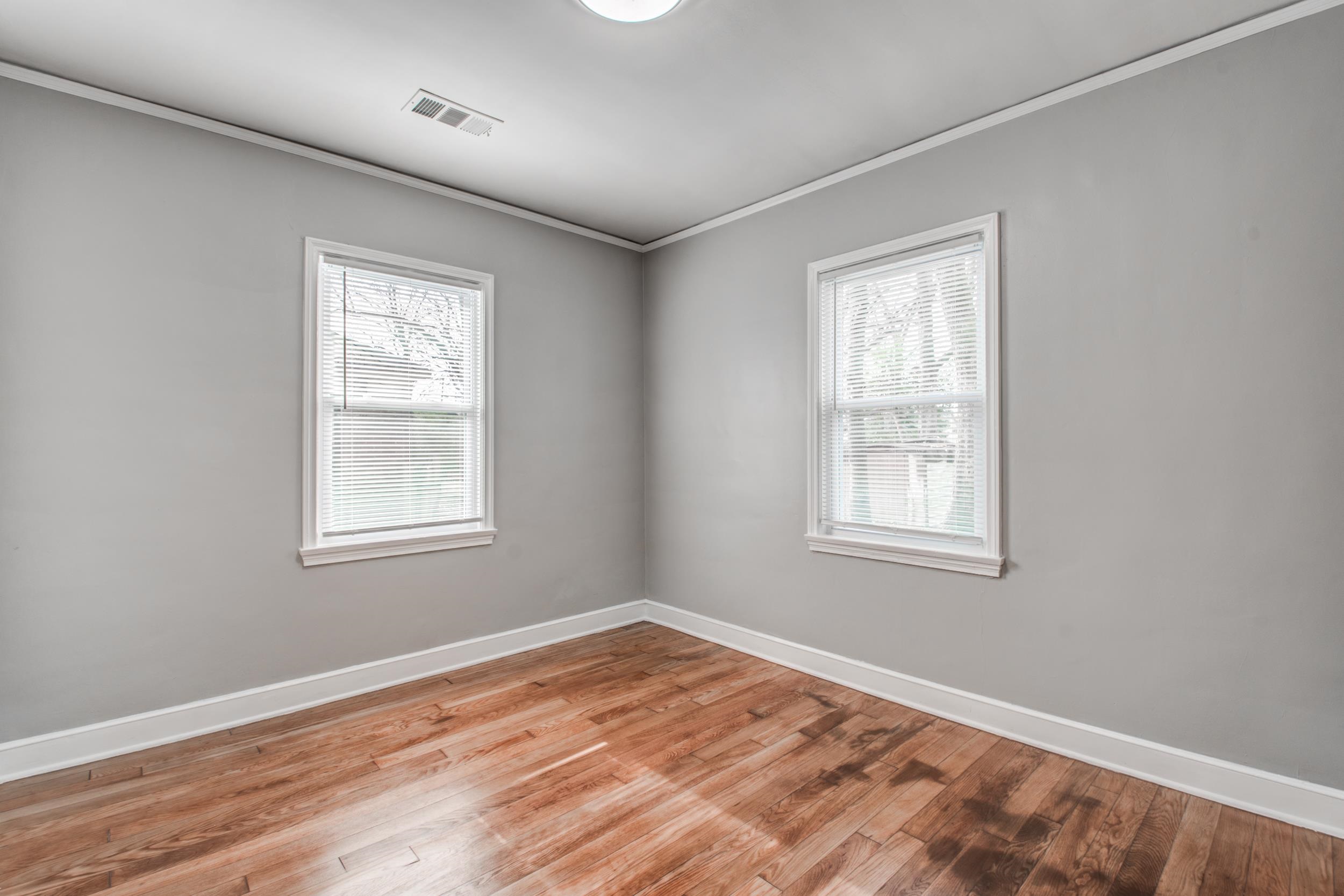 835 Watson Street Memphis, TN 38111 - Photo 21 of 24 Unfurnished room with crown molding, light wood-style flooring, and plenty of natural light