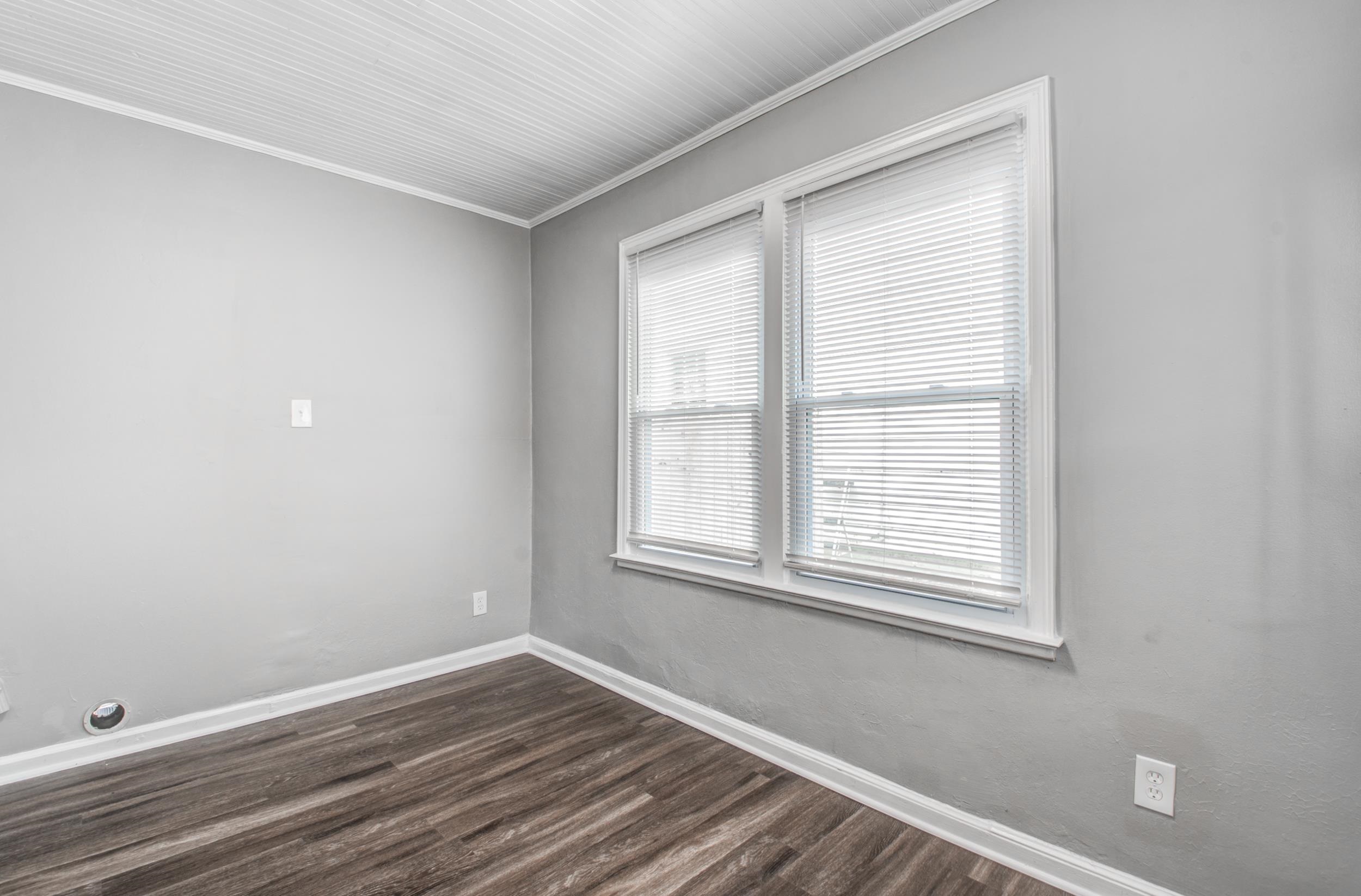 835 Watson Street Memphis, TN 38111 - Photo 23 of 24 Spare room with ornamental molding and dark wood finished floors