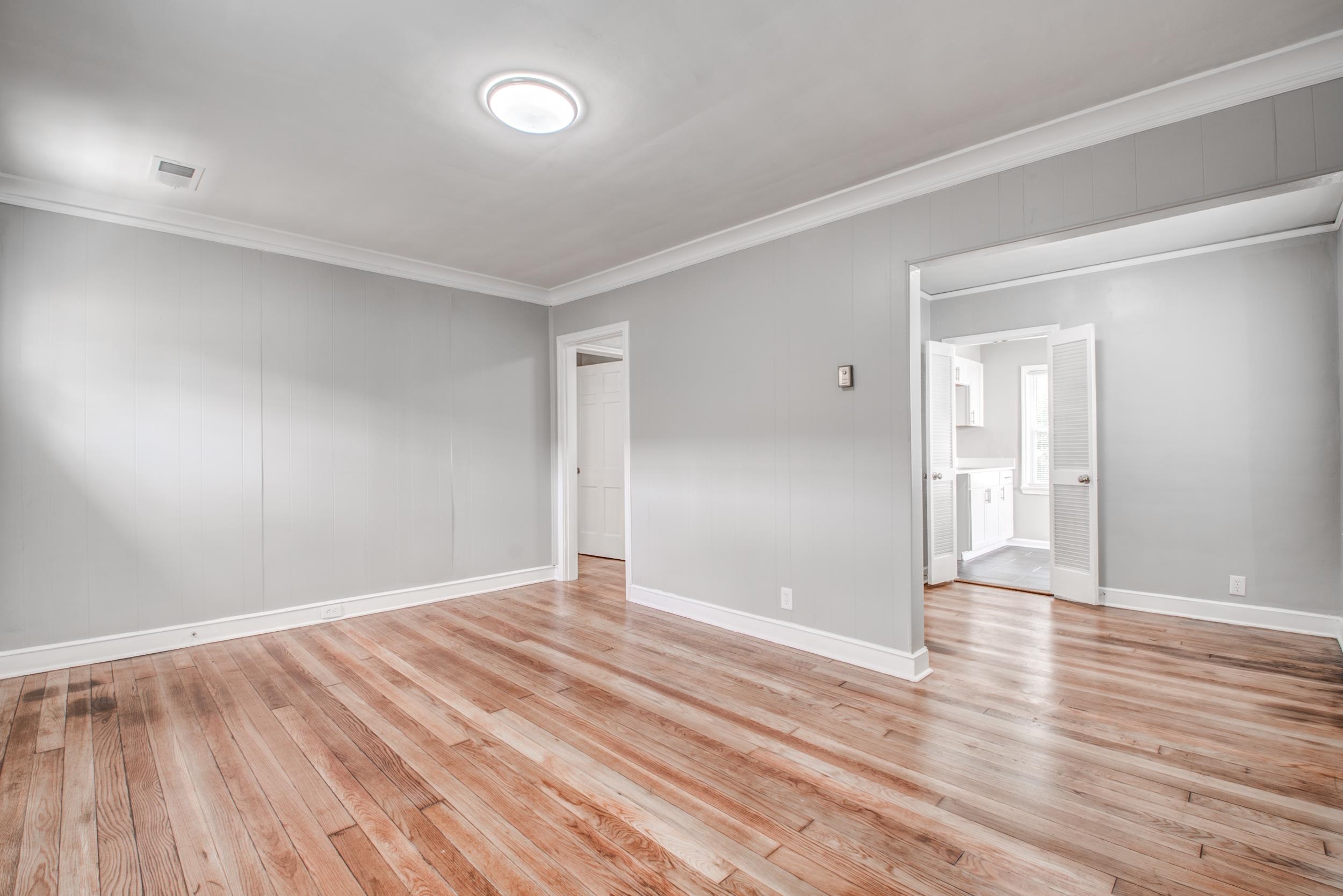 835 Watson Street Memphis, TN 38111 - Photo 5 of 24 Spare room featuring crown molding and light wood-style flooring