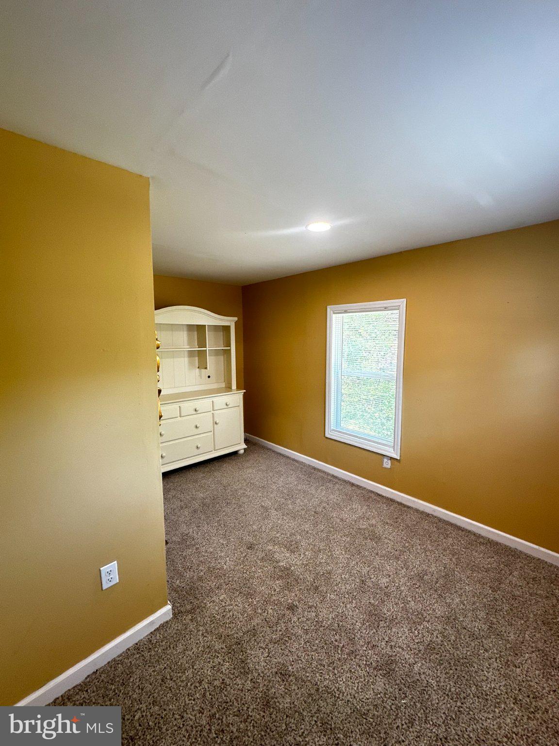 31777 Siham Road Lewes, DE 19958 - Photo 24 of 46 Cozy room with warm golden hues.