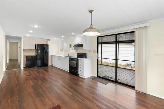 a bathroom with a sink vanity mirror and toilet