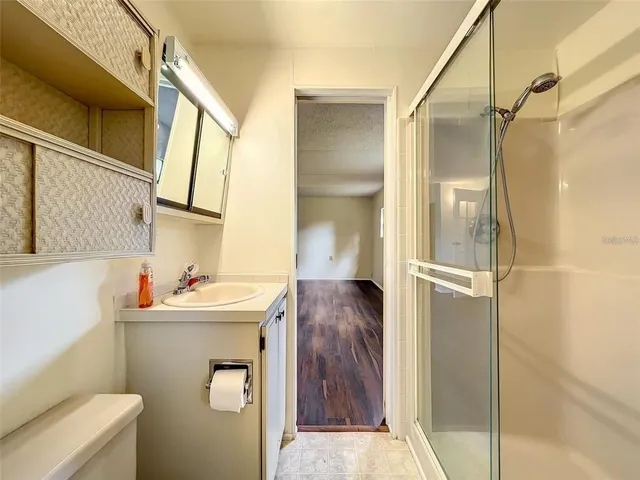 a view of a house with wooden deck and furniture