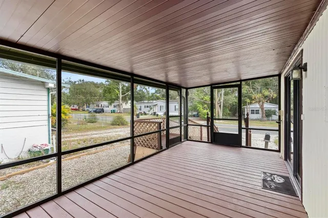 wooden floor in an empty room with a mirror