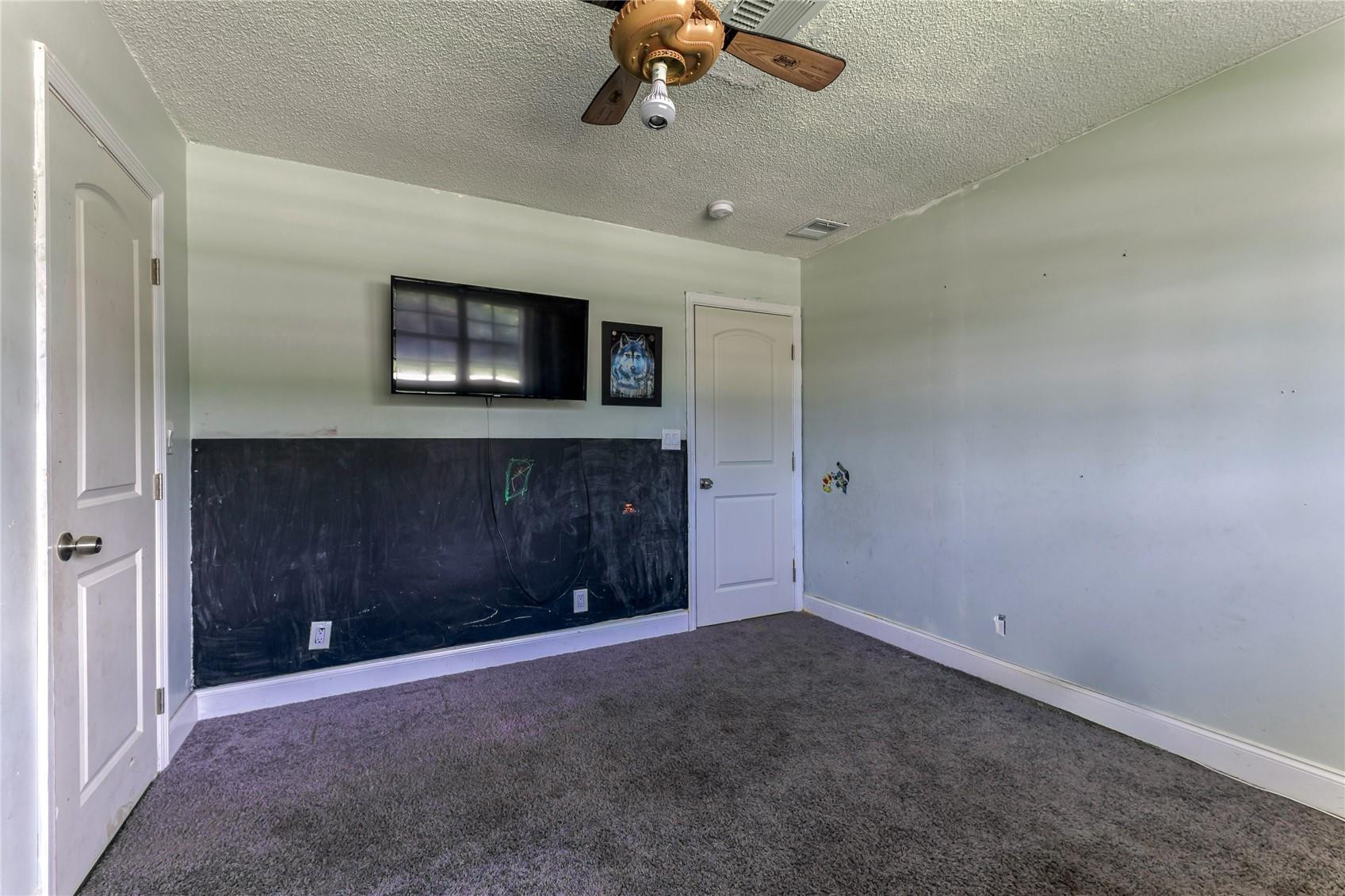 601 Southwest 8th Terrace Boca Raton, FL 33486 - Photo 35 of 47 en empty room with windows and fireplace