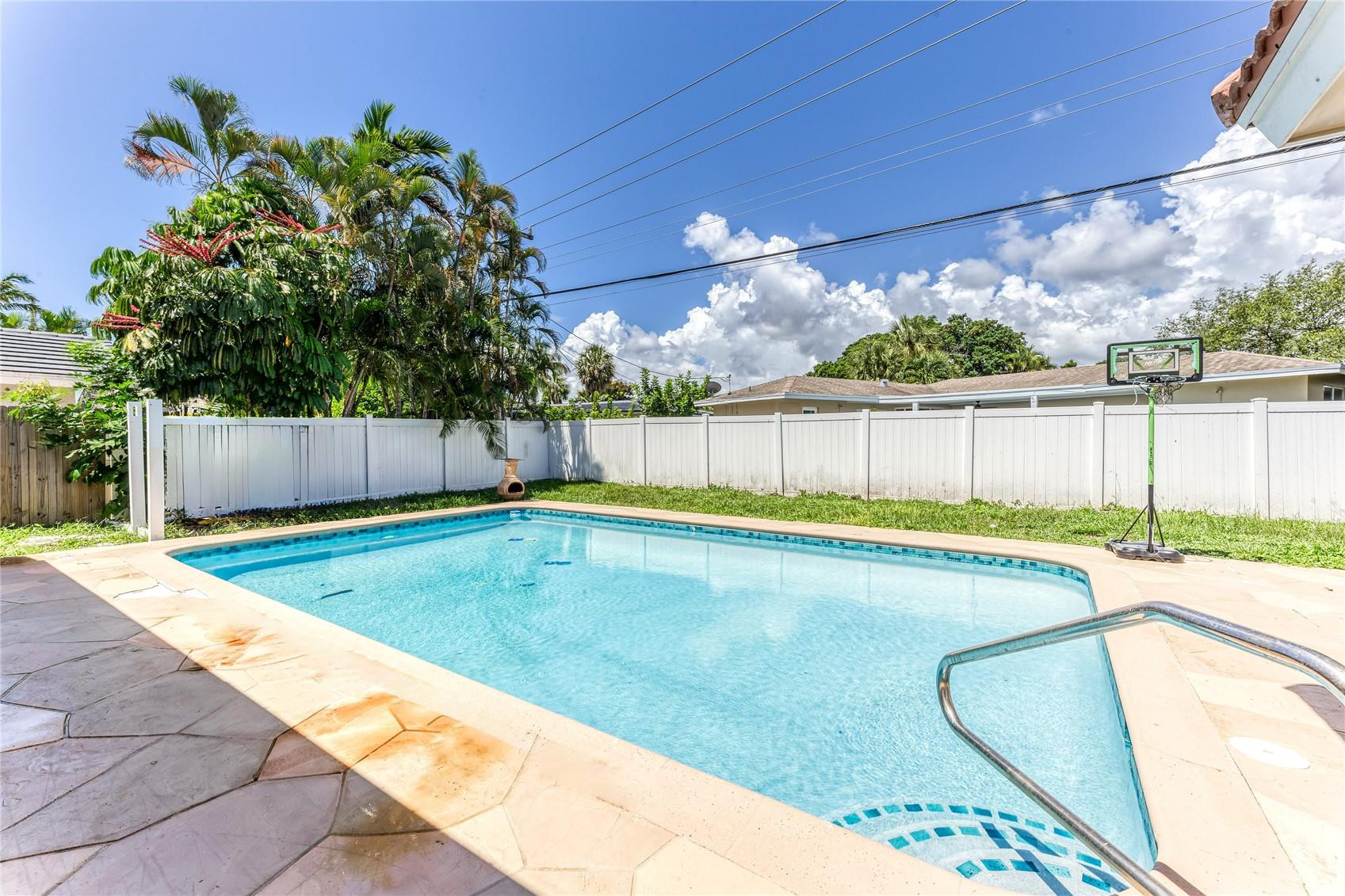 601 Southwest 8th Terrace Boca Raton, FL 33486 - Photo 4 of 47 a view of a swimming pool with a yard