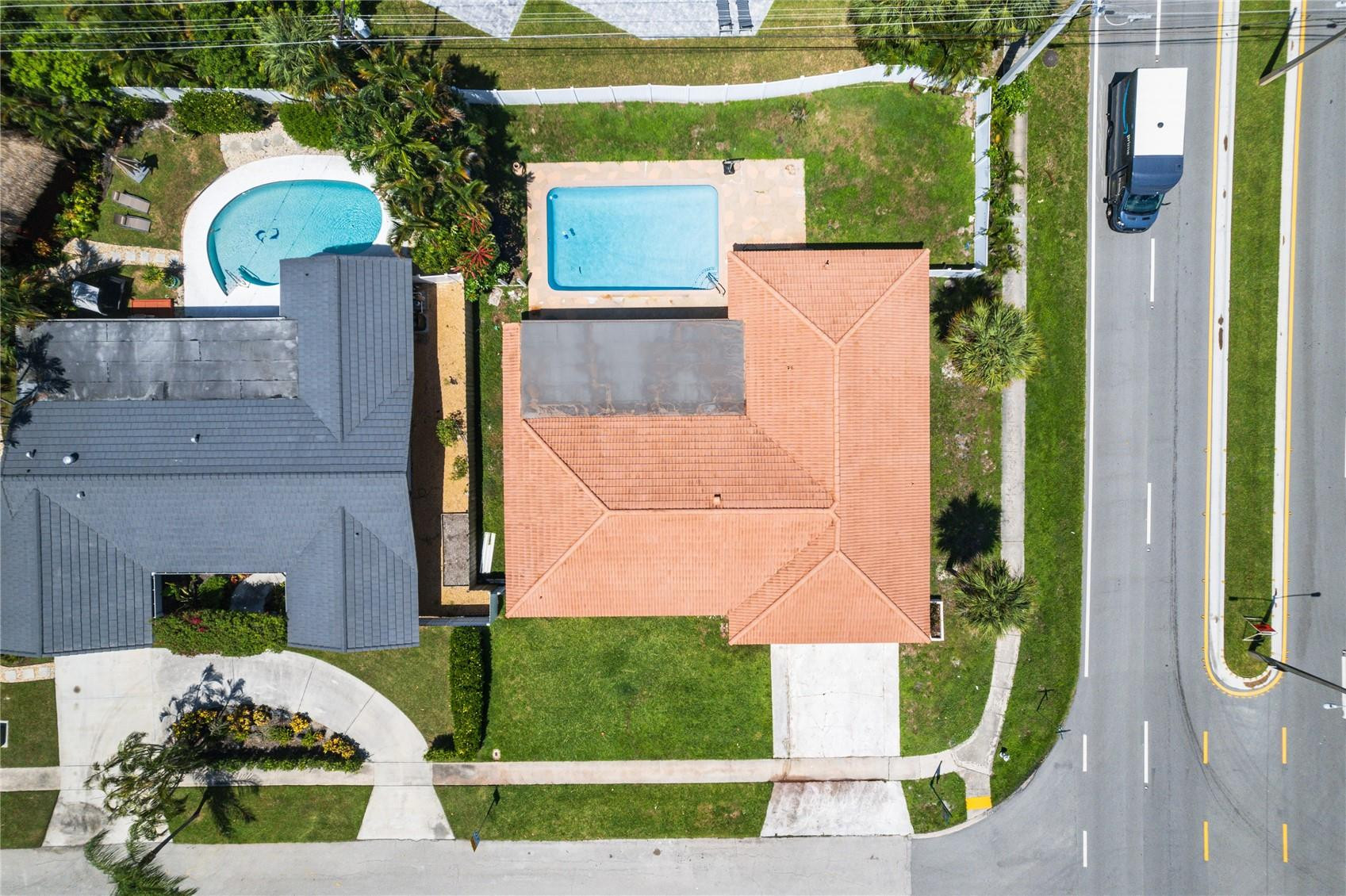601 Southwest 8th Terrace Boca Raton, FL 33486 - Photo 45 of 47 an aerial view of a house with a yard and potted plants