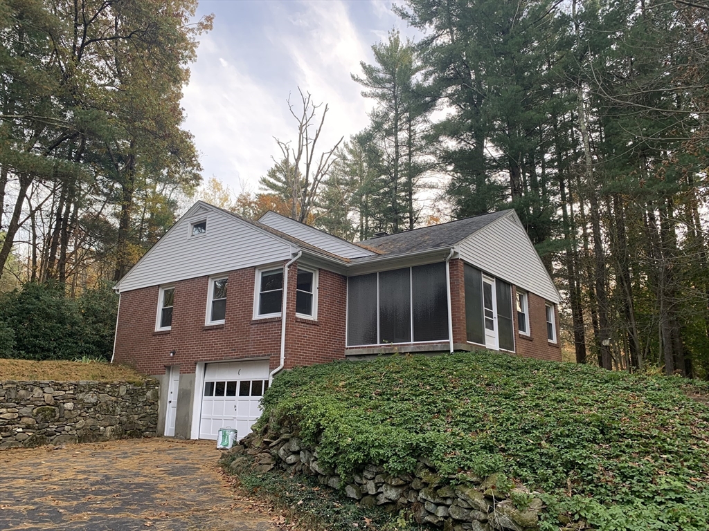 124 Brimfield Road Monson, MA 01057 - Photo 1 of 36 a front view of a house with a garden