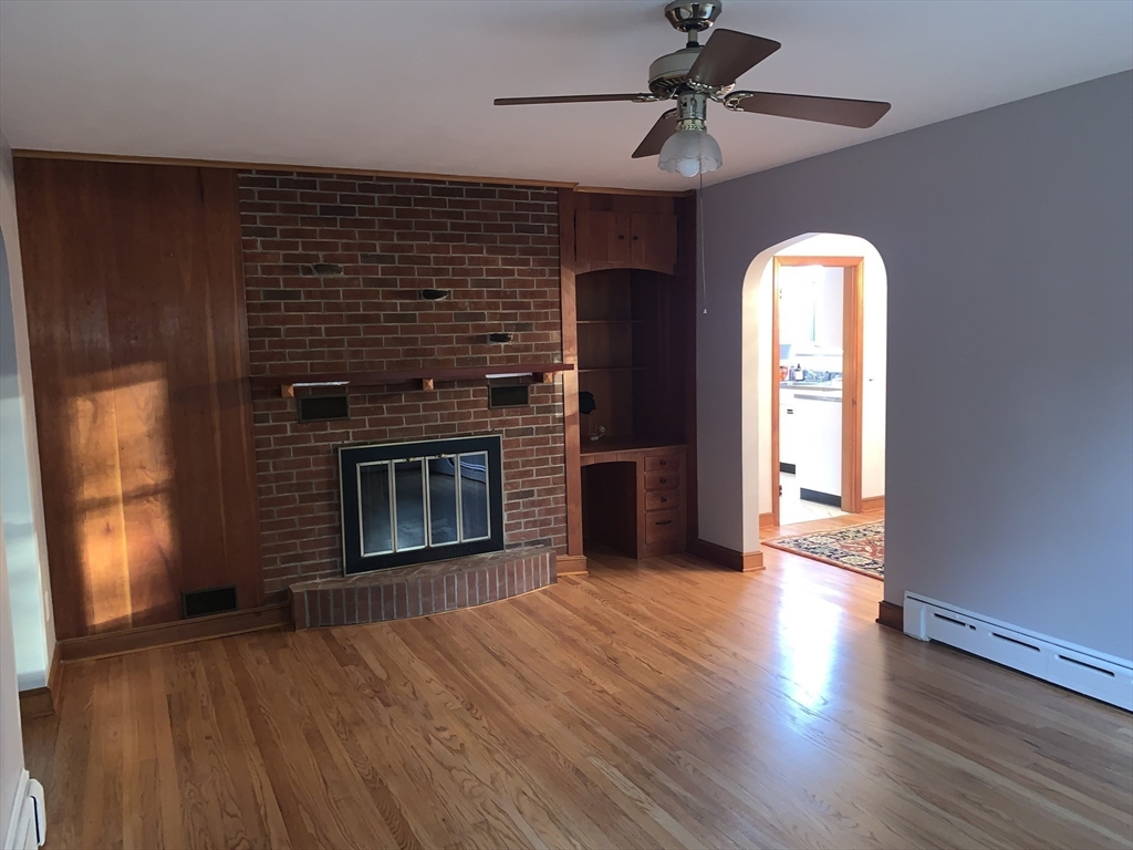 124 Brimfield Road Monson, MA 01057 - Photo 15 of 36 a view of a livingroom with wooden floor a ceiling fan and window